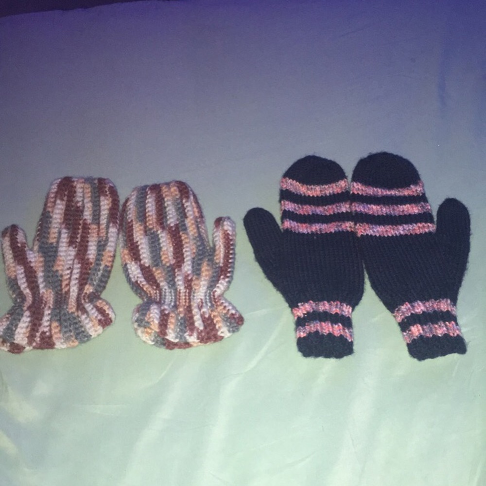 two pairs of knitted mittens